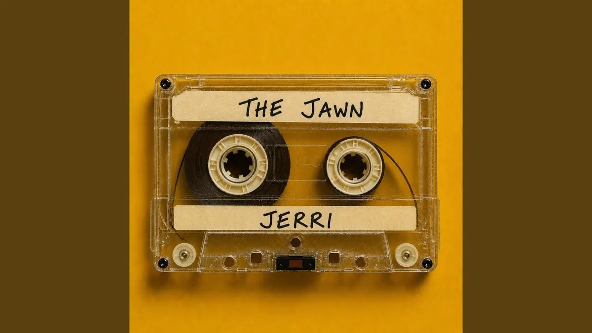 Cover art for The JAWN by Jerri: a clear cassette tape with handwritten labels on a yellow background.